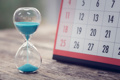 hour glass and corner of a calendar