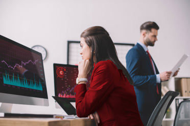 woman looking at graph on computer