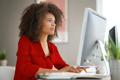 focused business woman looking at computer