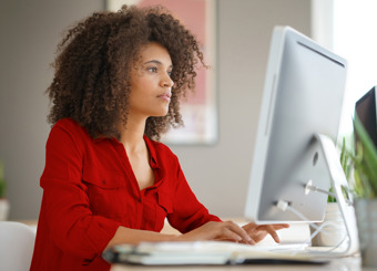 focused business woman looking at computer