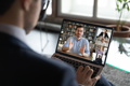 Person watching a webinar on computer