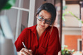 woman writing at her desk