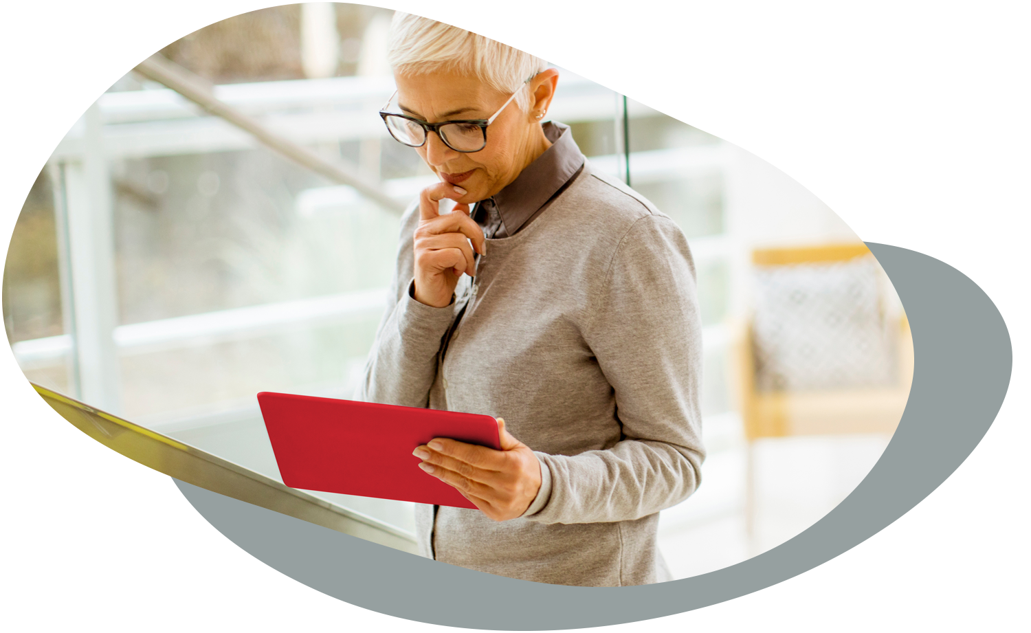 Female thinking while looking at tablet device