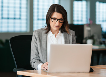 Business Woman Working by Computer
