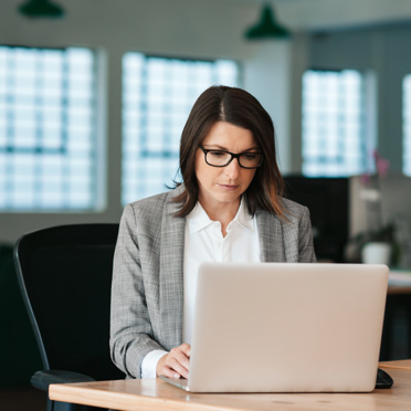 Business Woman Working by Computer