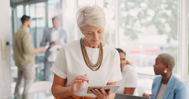 Mature Business Woman Working Device