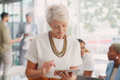 Mature Business Woman Working Device