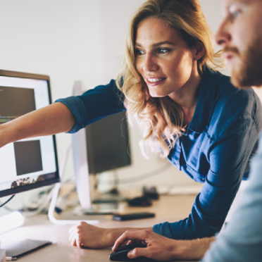 woman pointing at computer