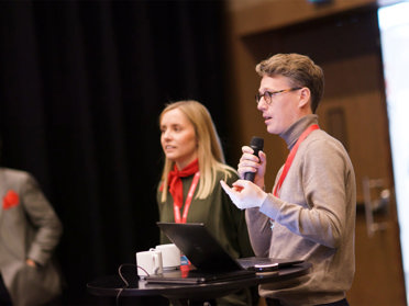 man speaking at professional event